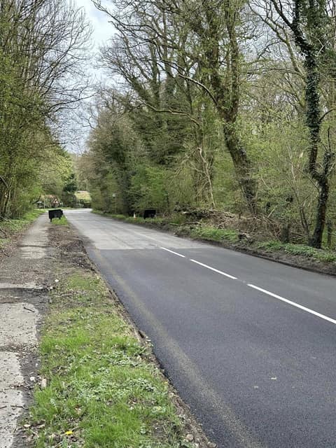 Freshly resurfaced Longbottom Lane, straight section with verge