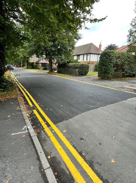 Freshly surfaced Cherry Tree Road with double yellows