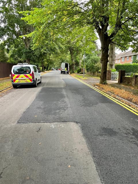 Cherry Tree Road under trees with a works van